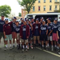 <p>The U14 Ridgewood Junior League All Star Team poses after exiting their buses. </p>