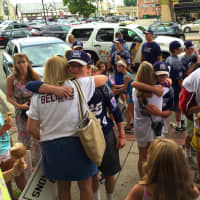 <p>Players embrace their family and friends after their return from the Junior League World Series</p>