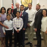 <p>Cruz stands with family, Police Chief Glen Cauwels and Borough Council members.</p>