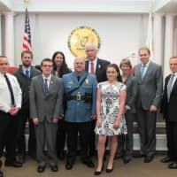 <p>Sgt. Wood with Police Chief Cauwels (far left), Capt. Robert Kneer (far right), Mayor and Council and family.</p>