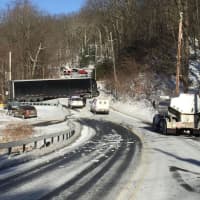<p>Slippery roads caused a large tractor-trailer to become stuck when it couldn&#x27;t travel up a grade in the roadway.</p>