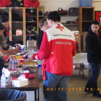 <p>Volunteers enjoy a free buffet before heading out to install free smoke alarms.</p>