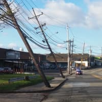 <p>Utility poles tipped by the winds.</p>