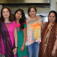 <p>A crew of six kitchen volunteers who prepared a multi-course vegetarian meal for everyone in the temple one recent Sunday night. Six crews rotate this duty so that a meal is served every Sunday.</p>