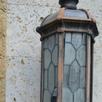 <p>A damaged light outside the front door. It was hit by vandals soon after the temple opened.</p>