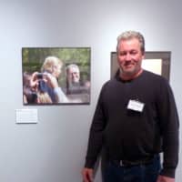 <p>Photographer David Rocco with his photo of Donald Trump and Louis Cappelli. </p>
