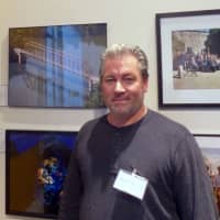 <p>Photographer David Rocco with his photo of the North County Trailway Croton Reservoir Railroad Bridge.</p>
