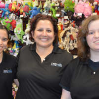 <p>Christine Peterson, center, assistant manager of Pet Valu in Dumont, with some of her staffers.</p>