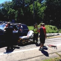 <p>A person injured in a two-car accident on Route 6N in Mahopac Falls Thursday is tended to by emergency medical workers.</p>
