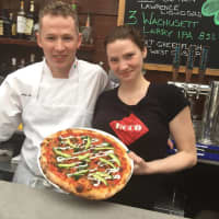 <p>Showing off the signature brick oven pizza at ECCO Eatery in Bethel.</p>