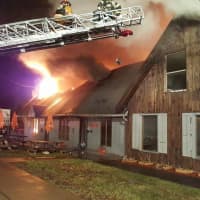 <p>The Red Cross is working on relocating residents in the apartments of the Red Hook shopping center, which was destroyed by fire Tuesday.</p>