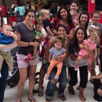<p>Annie Joachim of Westwood, center, holds Charlotte, surrounded by moms and children from the Monday afternoon playgroup that stemmed from Bergen County Moms on Facebook.</p>