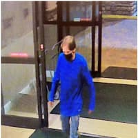 <p>Police are attempting to identify and locate a man who may have information regarding a robbery of a Holiday Inn in Danbury.</p>