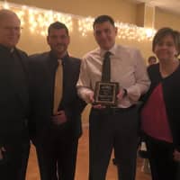 <p>The Caggiano family accepts their award at the first St. Anne Hal of Fame dinner Oct. 23 in Fair Lawn. </p>