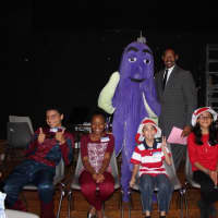 <p>Mount Vernon Superintendent Kenneth Hamilton and OLI the Octopus with elementary students.</p>
