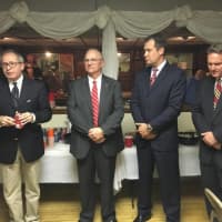 <p>Former Carlstadt Mayor William Roseman congratulates Republicans Craig Lahullier, the new mayor, and council victors William Shockley and Robert Zimmermann.</p>
