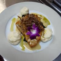 <p>Red snapper in a lemon basil beurre blanc sauce with crispy leeks.</p>