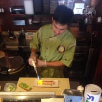 <p>Head Chef Joe Liu applies a flame directly to the salmon roll to bring out the flavors from within. Liu will also be the head chef in Salsa Metsuyan.</p>