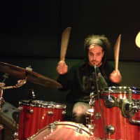 <p>Static takes a break at work to freestyle a drum solo.</p>