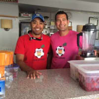 <p>Andy Pada (left) and Chad Dictenberg serving up smoothies on Sept. 11.</p>