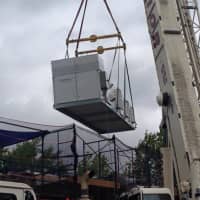 <p>The new HVAC unit being craned into the New Rochelle YMCA pool. </p>