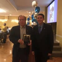 <p>Edward Trawinski receives his plaque at the first St. Anne Hall of Fame dinner Oct. 23 in Fair Lawn. </p>