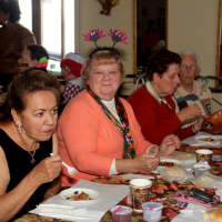 <p>Seniors enjoy a meal at the Halloween Party.</p>