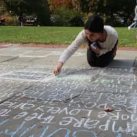 <p> Scarsdale High School students participated in &quot;Sounds of Sonnets&quot; poem chalking event last week.</p>