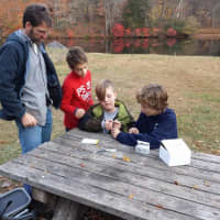 <p>Teacher guides students during the water study.</p>