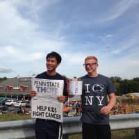 <p>Pennsylvania State University sophomores Tyler Staffin, right, and Mickey Sangteerasintop, raise money for pediatric cancer outside of Demarest Farms on Saturday, in Hillsdale.</p>