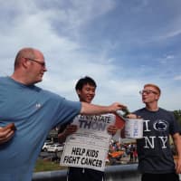 <p>A Damarest Farm visitor donates to THON before apple picking on Saturday in Hillsdale.</p>