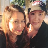 <p>Kristen Castro, left, and Danielle Koehn, of Waldwick, rock Younique apparel at Pearl River Day on Oct. 11.</p>