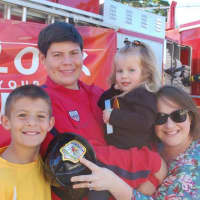 <p>Jake and Matthew Glanz enjoy the Ho-Ho-Kus Fire Department open house with their cousin Veronica and aunt Chrissy LaBate.</p>