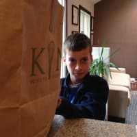 <p>A youngster bids farewell to his leftover Halloween candy that will make its way overseas to U.S. soldiers.</p>