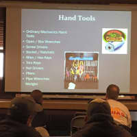 <p>Firefighters watched a slide show during the workshop.</p>
