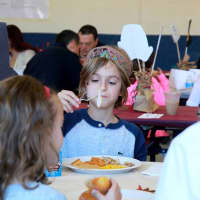 <p>Third-graders and their families enjoyed a traditional Thanksgiving meal. </p>