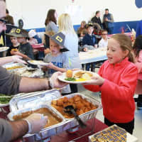<p>Columbus Elementary third-graders and their family shared an early Thanksgiving meal at the annual Thanksgiving Feast.</p>