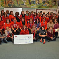 <p>The staff wearing red assembled for an announcement about the amount of money students contributed to fight leukemia.</p>