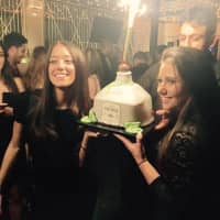 <p>Kara Schnaidt with a friend and her Patron cake.</p>