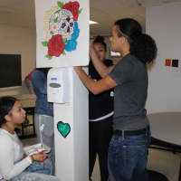 <p>Students from Summit Academy in Peekskill are showing their artistic skills as they help decorate the cafeteria.</p>