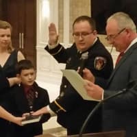 <p>Tom Dickman is sworn in as Saddle Brook fire chief on Sunday.</p>