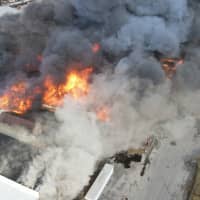 <p>A large fire at an industrial complex also sparked a brush fire.</p>