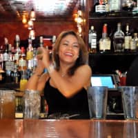 <p>Cuban Habana Cafe bartender Natalie Moscoso mixes up drinks for Sunday brunch.</p>