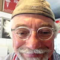 <p>After over 30 years of ownership, Dr. Mike still loves to make and dish up his ice cream at his Bethel shop.</p>