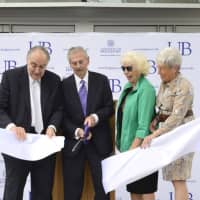 <p>From left, UB Board of Trustee Co-Chairman Frank Zullo, Trustee Ernie Trefz and his wife Joan, and Lt. Gov. Nancy Wyman officially open the Ernest C. Trefz School of Business in September 2014.</p>