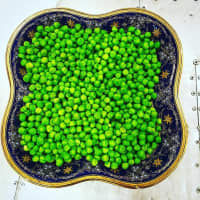 <p>&quot;Green peas on a vintage plate: Peas&#x27; mostly insoluble fiber helps promote intestinal motility. Did you also know that peas provide iron and is among only a few non-animal sources that do?&quot;</p>