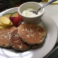 <p>Welsh breakfast cakes with lemon ricotta and fruit at Wobble Cafe in Ossining.</p>