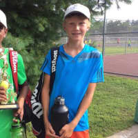 <p>Two young boys played in tournaments conducted by Slammer Tennis World in Norwalk.</p>