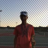 <p>A trophy winner shows the hardware he won at a USTA Tournament hosted by Slammer Tennis World of Norwalk.</p>