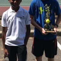 <p>Two young boys played in tournaments conducted by Slammer Tennis World in Norwalk.</p>